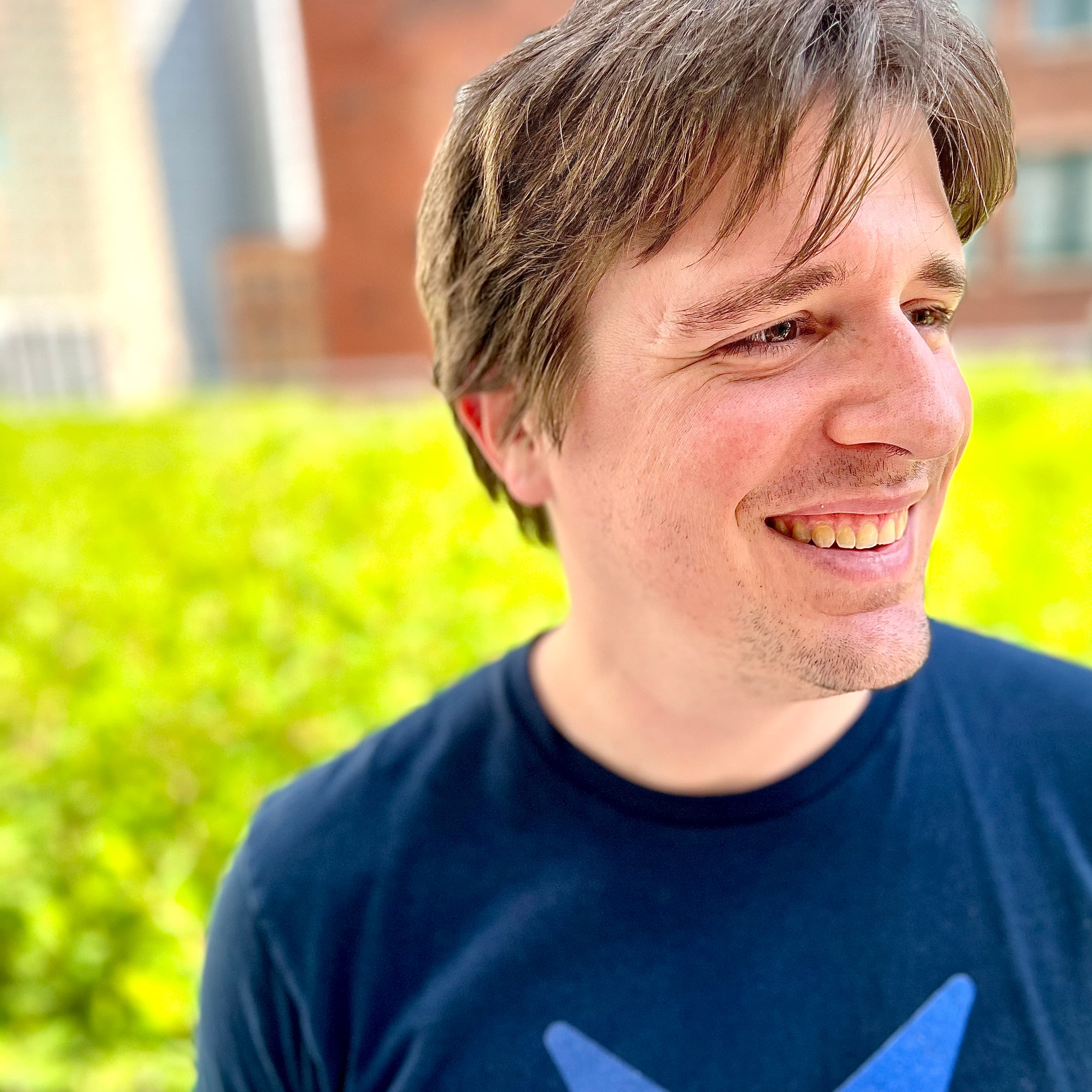 Michael surrounded by soft focus greenery
